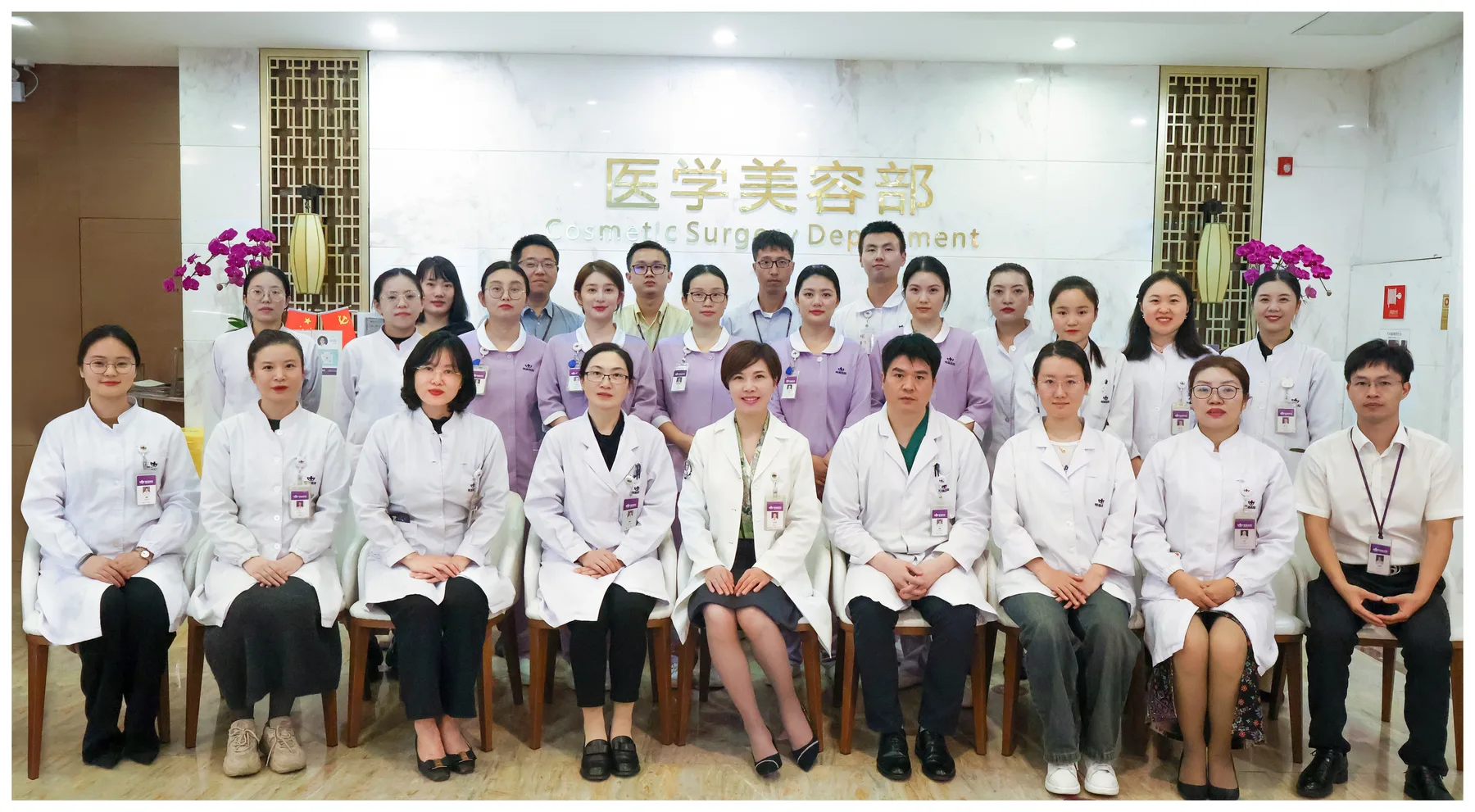 Staff of the BenQ partner department photographed together in its reception area.